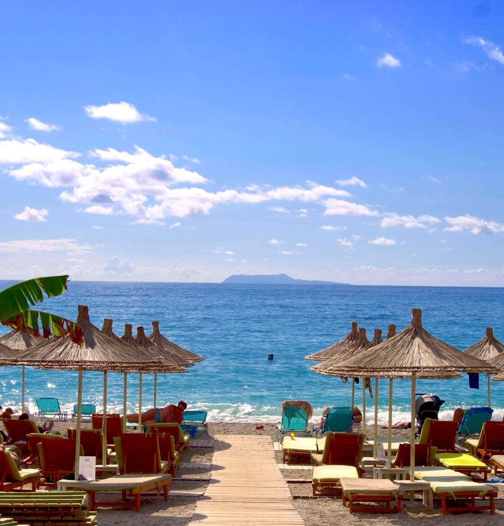 Beach and Hut during Daytime