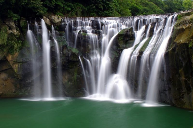 long exposure photograph of the shifen waterfall, a horseshoe waterfall in taiwan